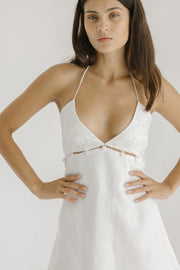 white linen halter mini dress with floral embroidery