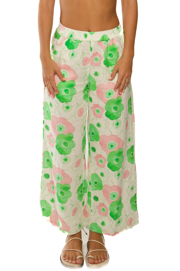 Green, pink and white linen pants with floral pattern made for women.