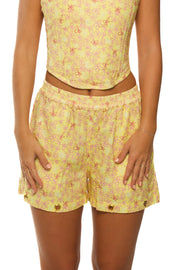 Yellow linen shorts with floral pattern made for women.