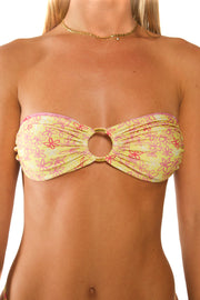 Yellow and pink reversible bandeau bikini made from recyclable fabrics.